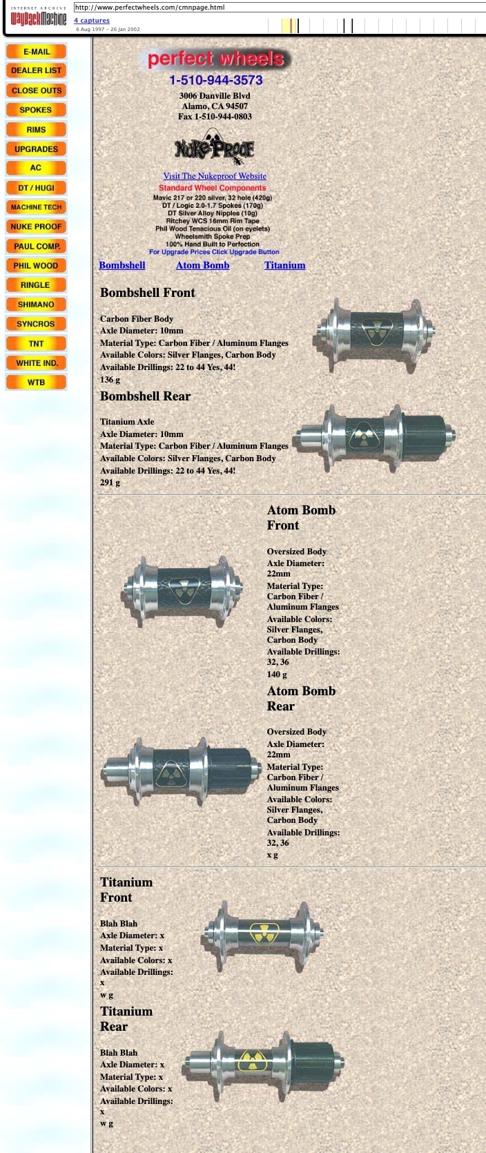 Archived perfectwheels.com Nukeproof hub catalog page from 1997: Bombshell and Atom Bomb carbon fiber hubs, with placeholder text on the unfinished Titanium listing