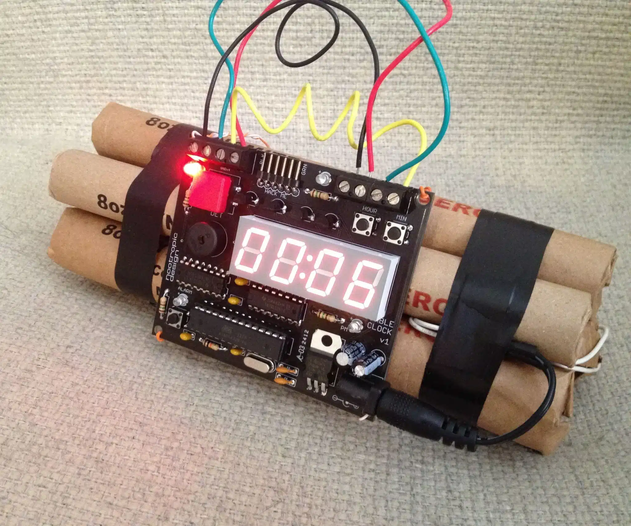 A stick of dynamite wired to a circuit board with a clock timer counting down, the image for Burst Timeout and the Session Death Loop on marknichols.com.